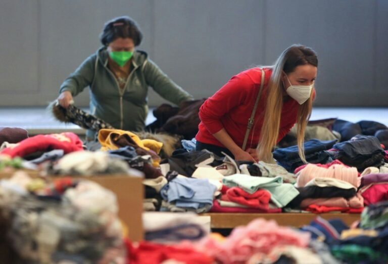 Volunteers sorting donated clothing