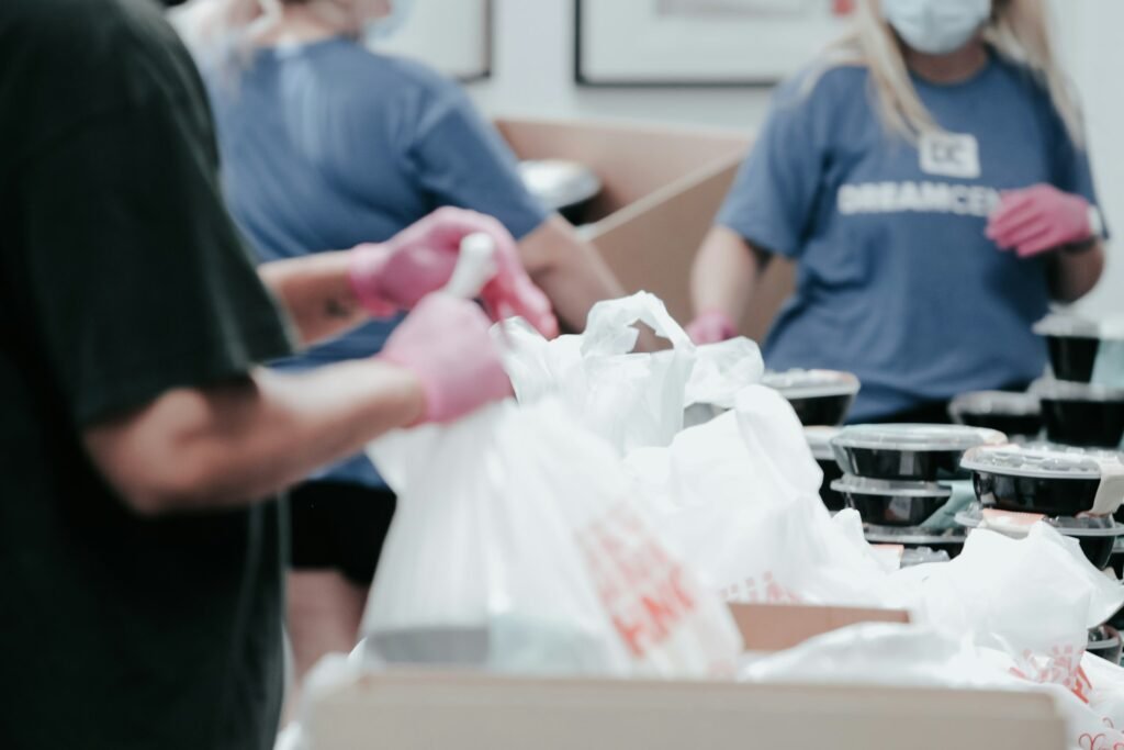 Volunteers packing food bags for families in need